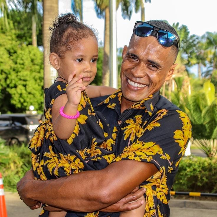 Alex Rivera, Lead Design Curator at Creek River Zephyr, reviewing corporate floral arrangements